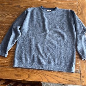 Like new L Woolrich Sweater. Grey with blue collar. This is a wool sweater.